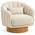 Fauteuil beige à dossier arrondi rainuré et base cylindrique striée